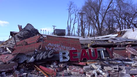 the ruins of a destroyed beauty salon following rioting  in ferguson missouri make an ironic statement