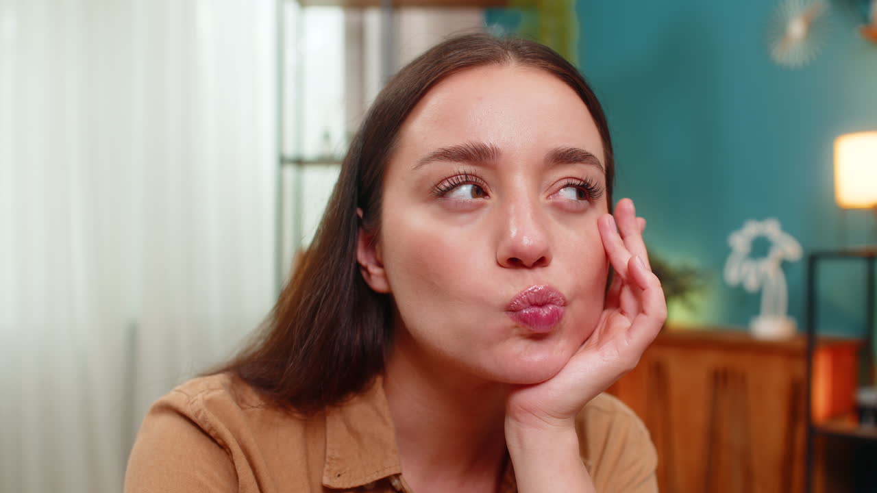 Young woman close up resting chin on hand thinking hard about solution looking for creative answer