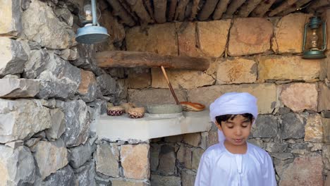 arab kid in arabian traditional house made with stone