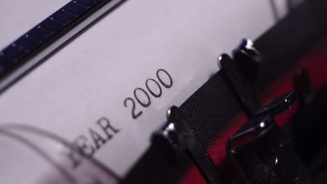 Year-2000,-Typing-on-Blank-White-Paper-in-Vintage-Typewriter,-Close-Up