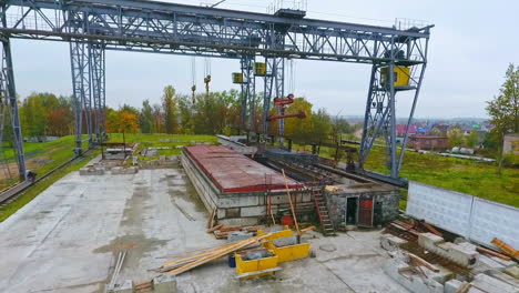 aerial view industrial crane work with load. crane works on industrial plant