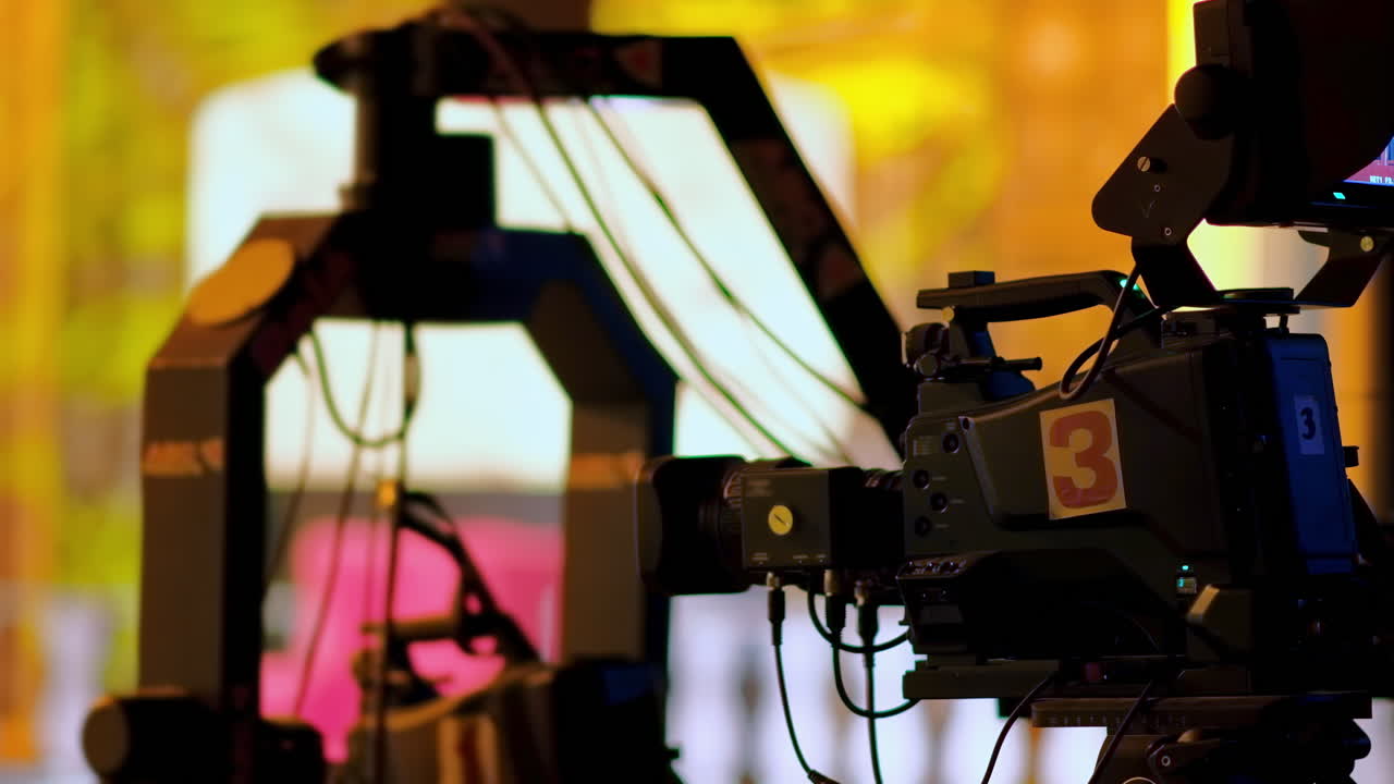Professional camera filming with on the backstage of a TV set