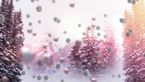 digital composition of multiple covid-19 cells moving against snow landscape with trees