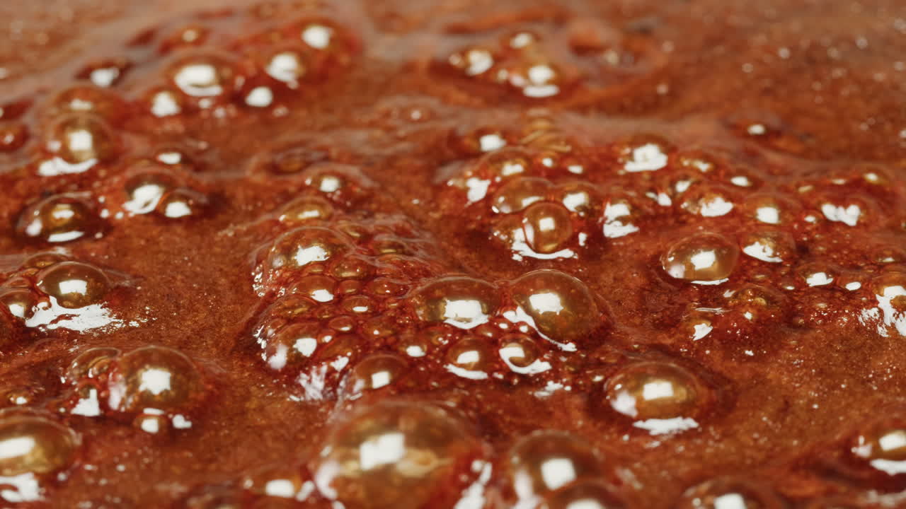Close-up of Boiling Caramel with Bubbles