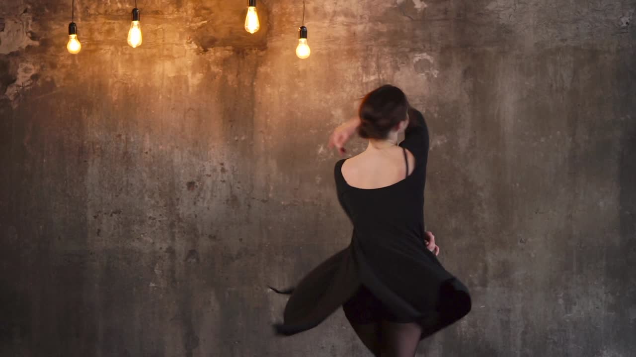 A Woman Dancing in a Black Dress