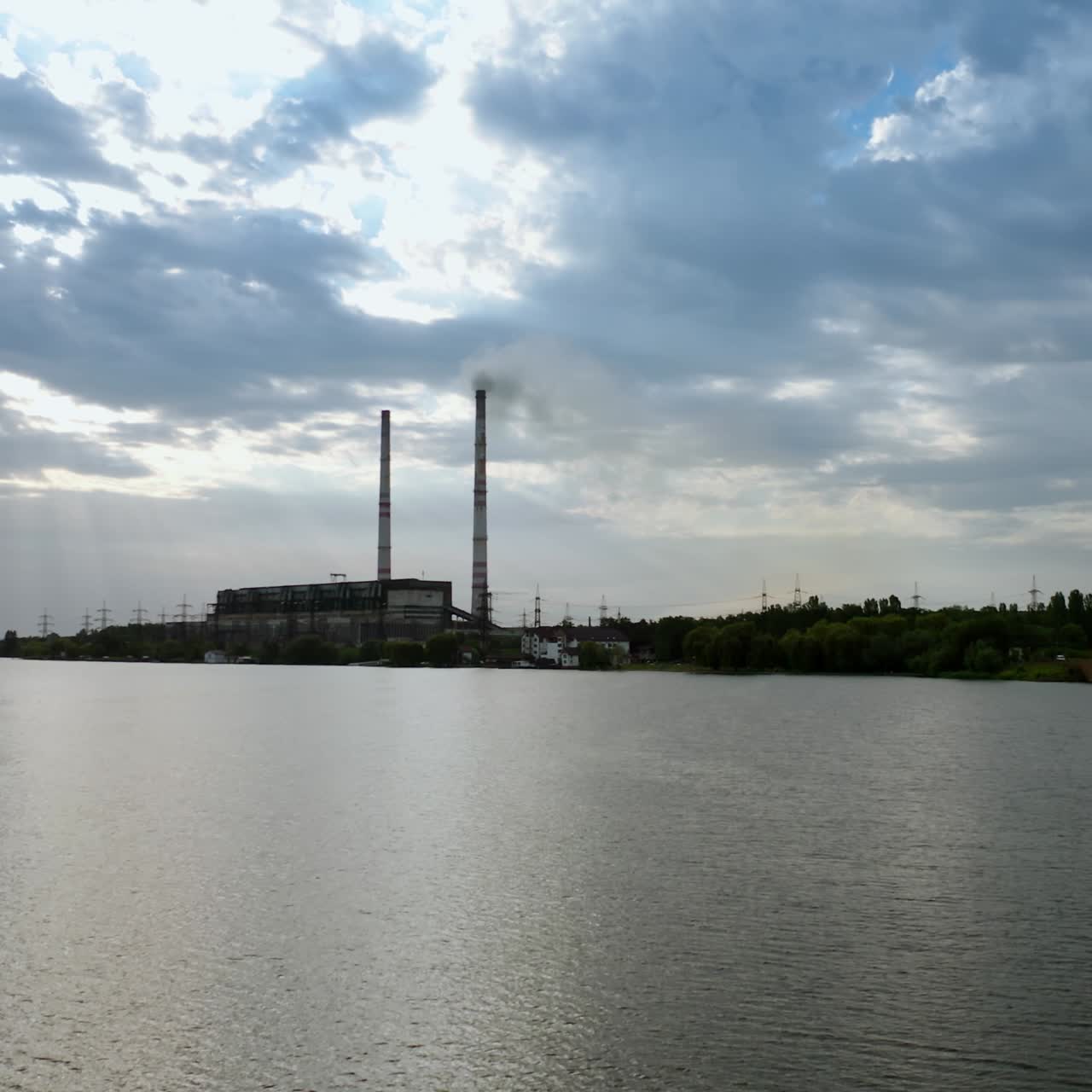 Drone shot flying over factory. Aerial view of plant factory at industrial production area