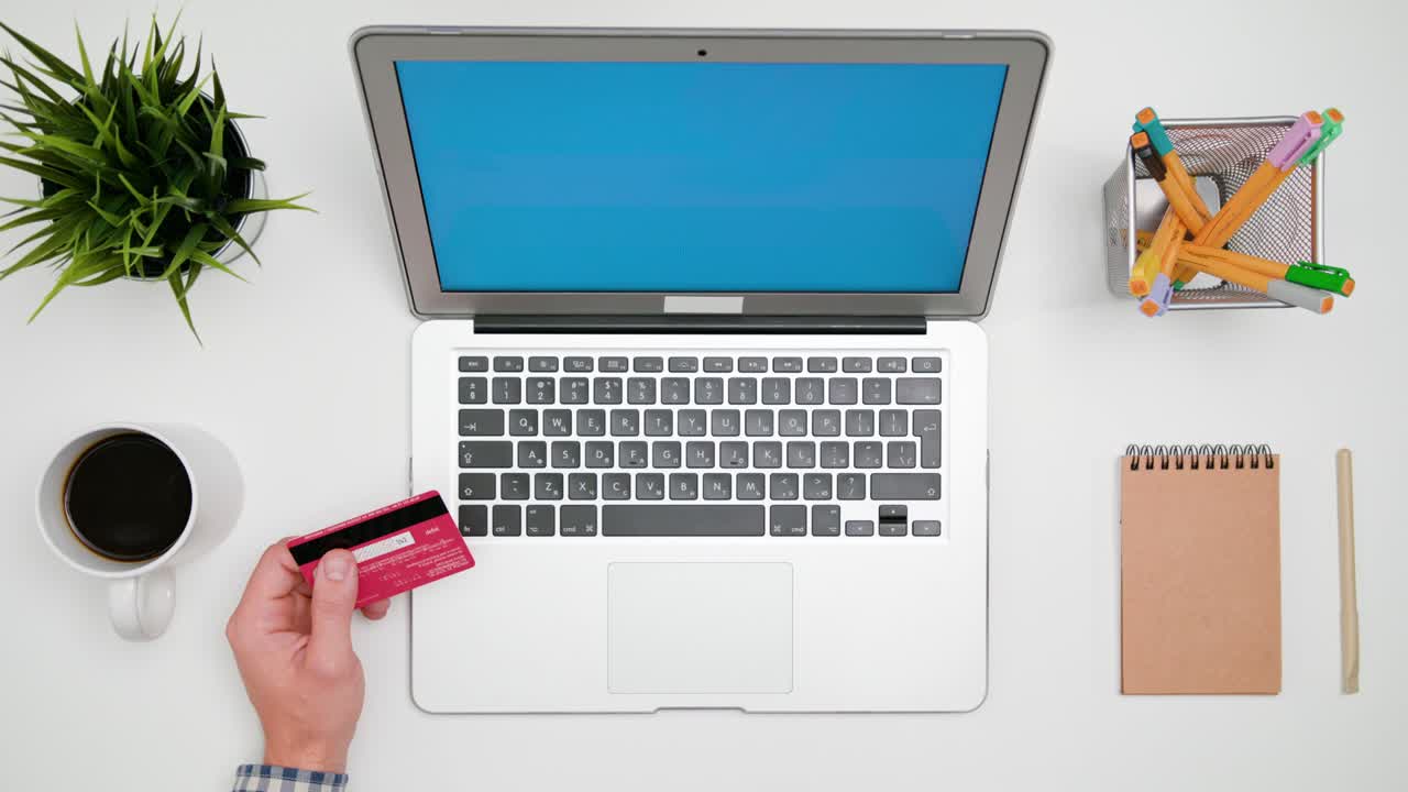 A Man's Hands Typing on the Laptop