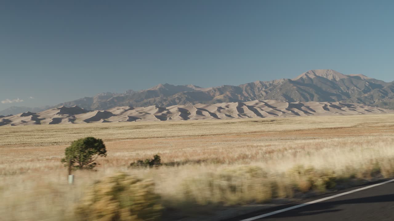Scenic Landscape with Mountains and Sand Dunes