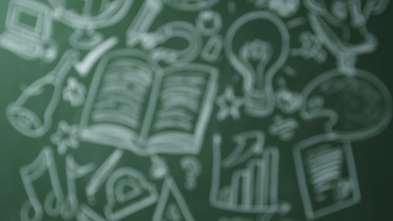 Drawn symbols of school subjects on chalkboard pull to focus, shot on R3D