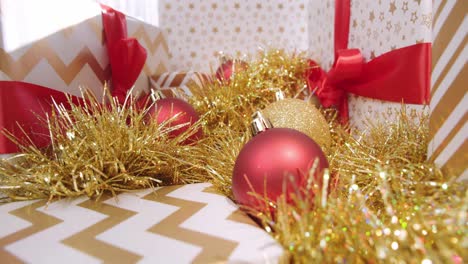 christmas presents and ornaments set up red white and gold