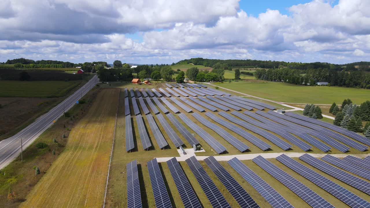 Solar panel field near countryside road in Michigan, aerial view