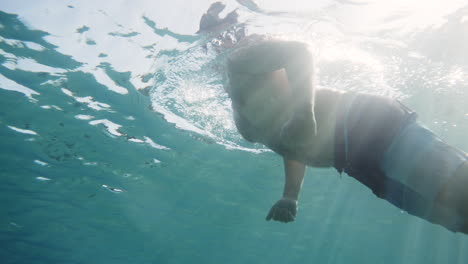 man snorkeling underwater