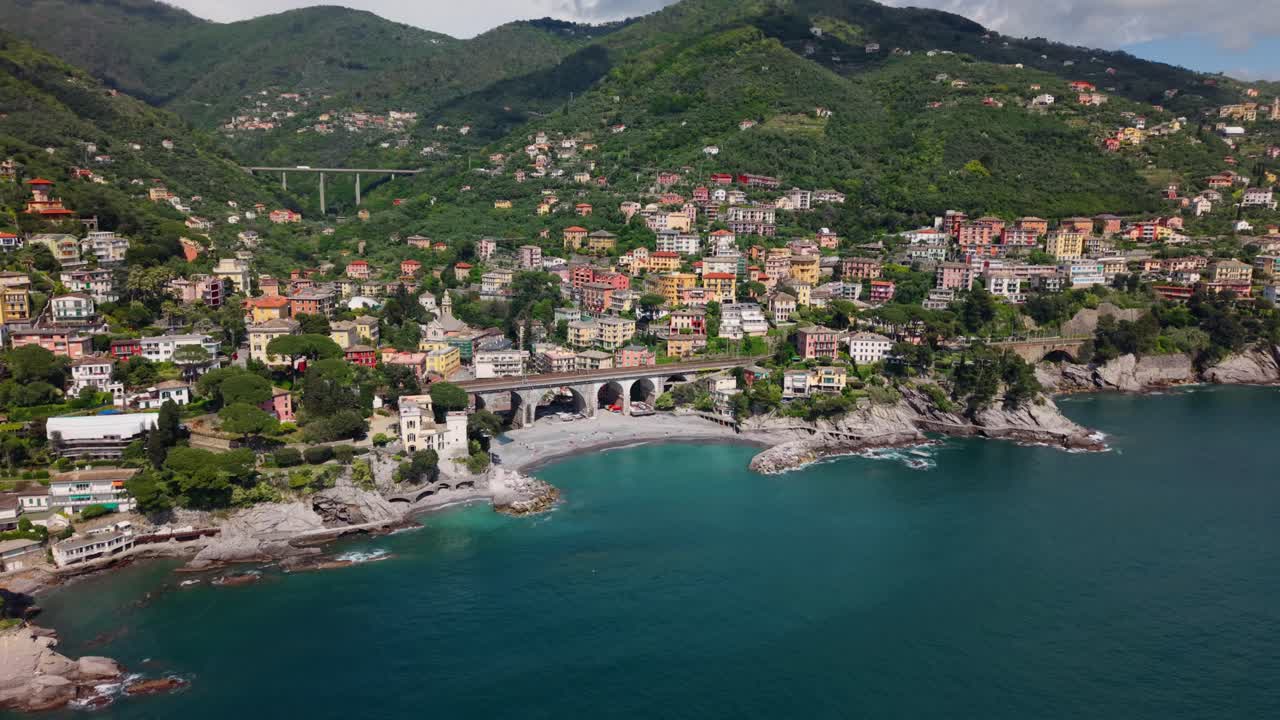 A colorful italian coastal town overlooking the mediterranean sea, aerial view
