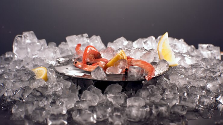 SUPER SLOW MOTION fresh scampi shrimps falling on an ice pile. Shot with high speed camera, 420 FPS