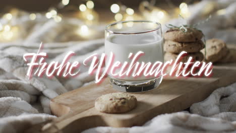 frohe weihnachten text in white over christmas cookies and milk with bokeh lights