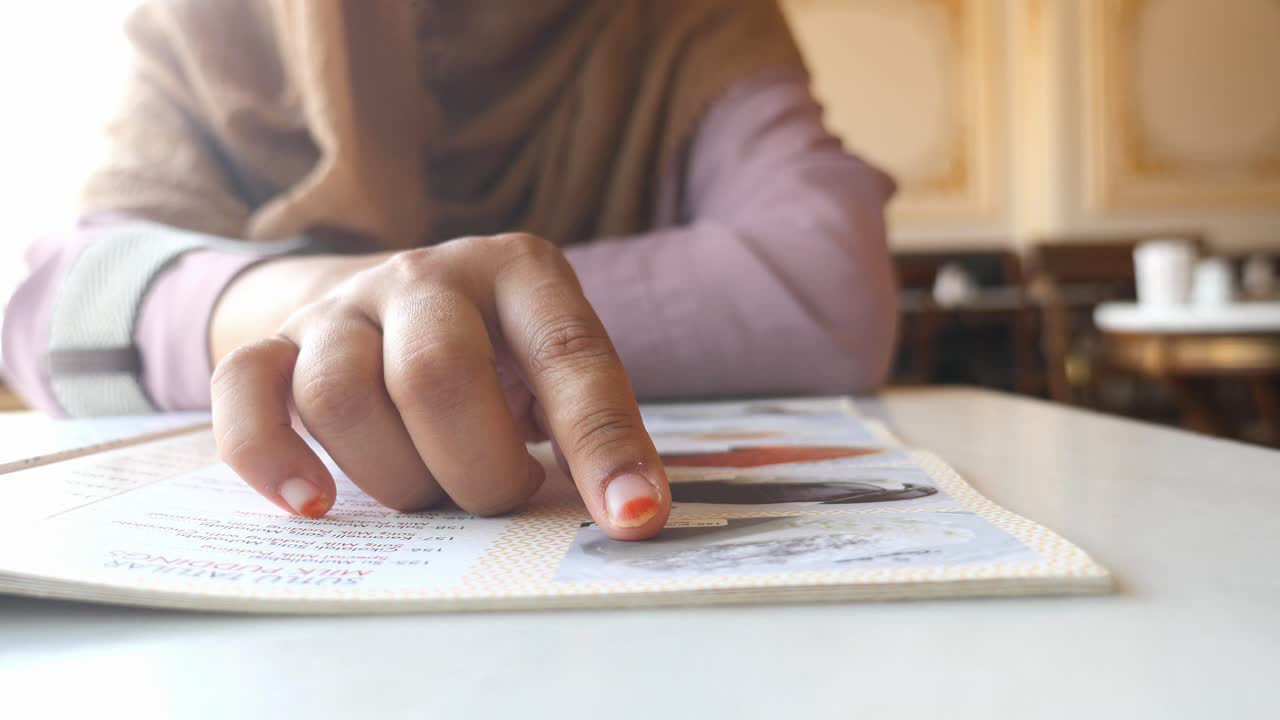 Woman looking at a dessert menu
