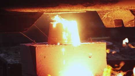 molten metal pouring into a mold