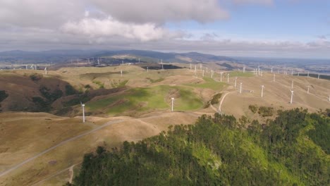 aerial fly-in to a 2 propellor wind farm in manawatu, new zealand