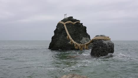 waves and bad weather over husband and wife rocks, meoto-iwa in mie japan