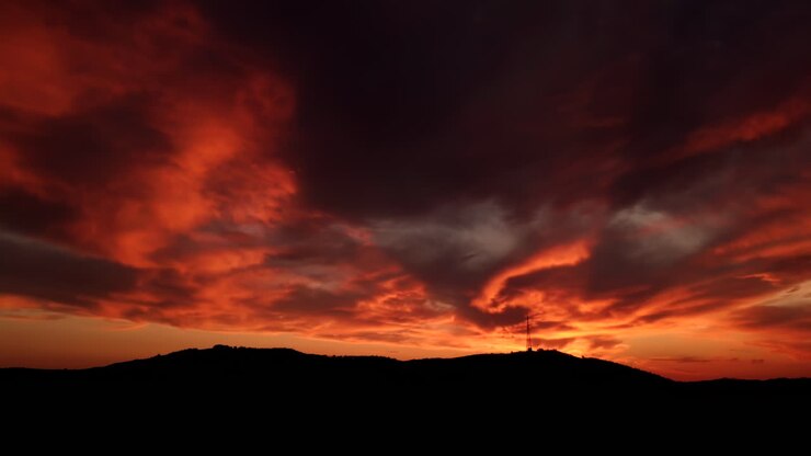 Spectacular sunset at the airport features cirrocumulus and beautiful sky with burning clouds a striking appearance resembling fire providing an ideal backdrop for a copy space image