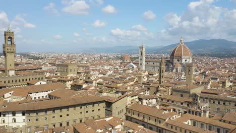 aerial pullback away from florence city centre on beautiful summer day