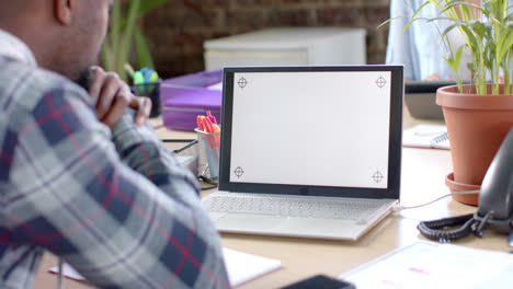 Focused-african-american-casual-businessman-having-laptop-video-call-with-copy-space-in-slow-motion