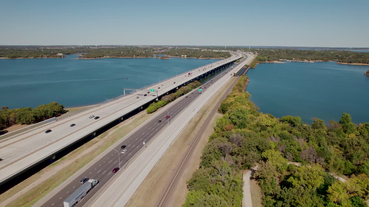 Aerial flight over highway I35E over Lake Lewisville in Texas