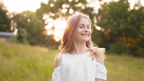 girl enjoying a sunset in the field