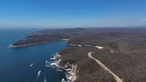 Soaring-above-National-Park-of-Bahias-de-Huatulco-in-Oaxaca,-Mexico