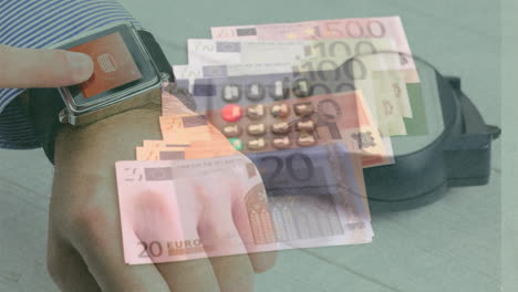 animation of close up of euro bills over mid section of man using smartwatch and card machine