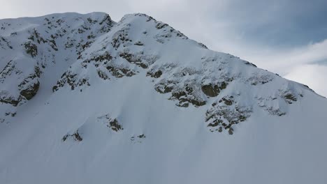 SlowMotion-Panoramic-Revealing-Drone-shot-of-the-Pirin-mountainpeak-Todorka,-in-Bulgaria