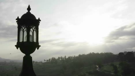 Time-lapse-of-clouds-over-a-street-lamp-and-forest-