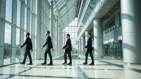 businessmen walking through a modern office corridor