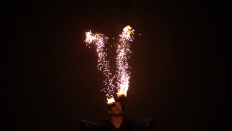 fire dancer making trails in the dark