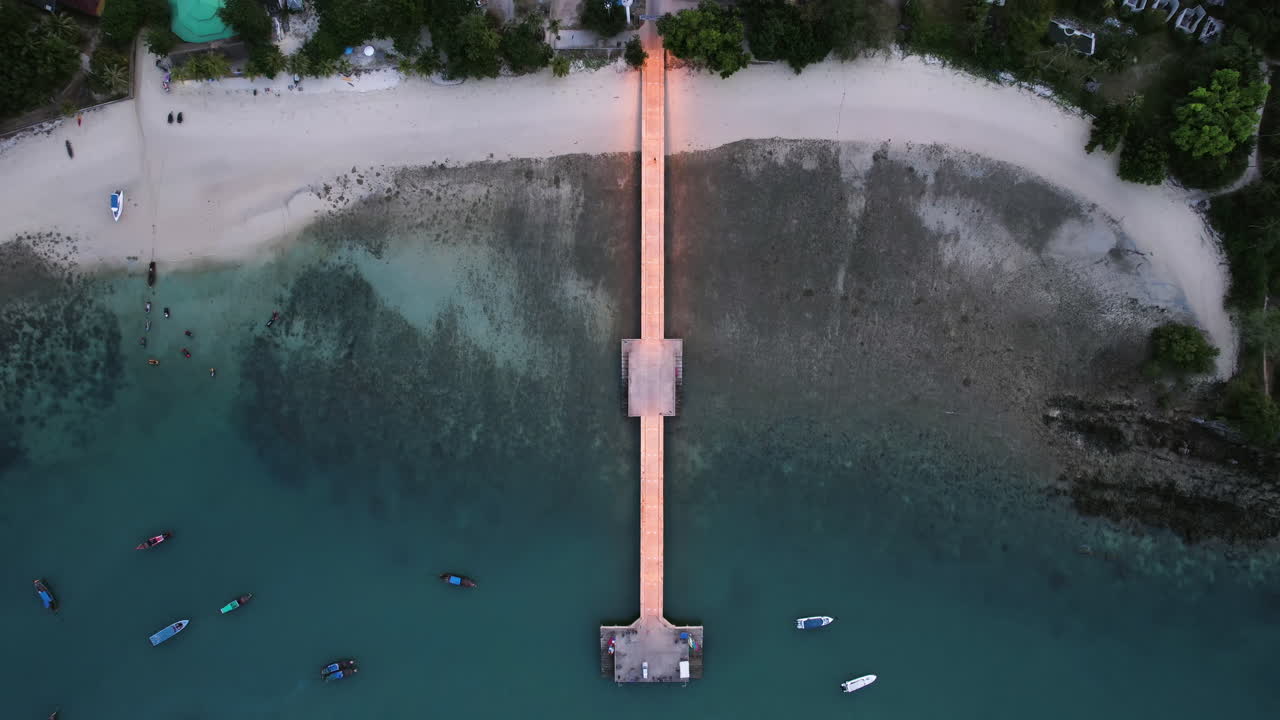 Birds eye drone shot above the Loh Jark Pier on Koh Yao Yai, dusk in Thailand