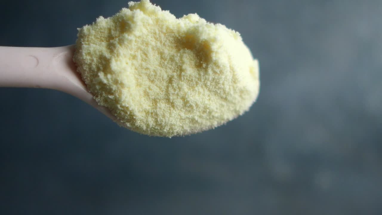 Baby Formula Powder in a Spoon
