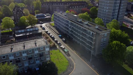 drone flying over streets and council housing estate in urban london