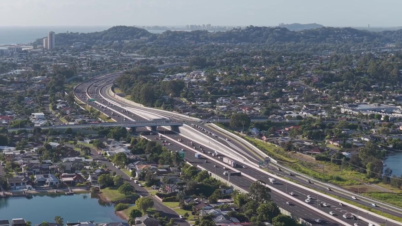 Traffic In M1 Pacific Motorway in Gold Coast, Queensland, Australia. - aerial shot