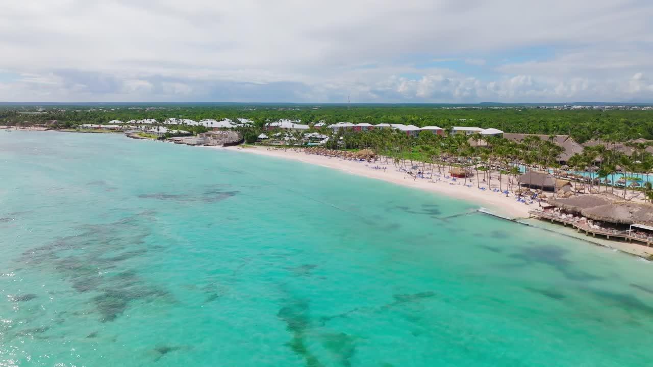 Aerial view of tropical Playa Blanca Beach with crystal clear water in Punta Cana, Dominican Republic