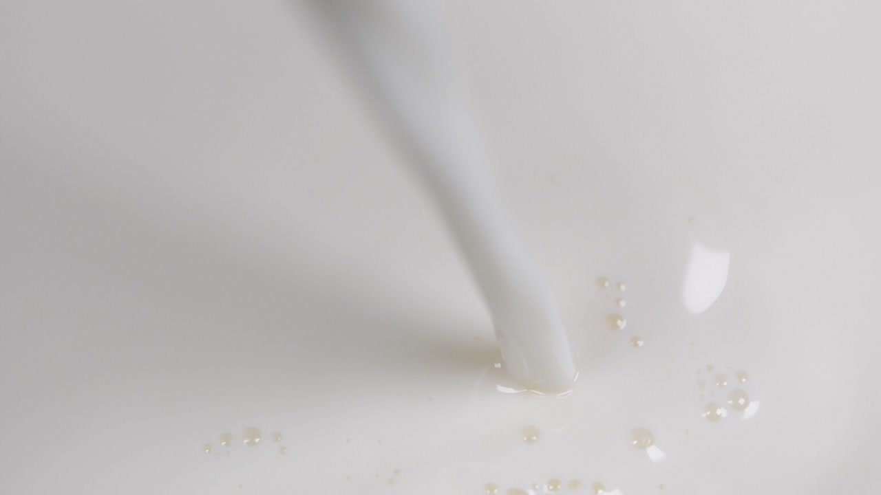 Pouring fresh milk in super slow motion 4k