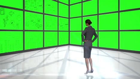 Businesswoman-looking-at-green-interface