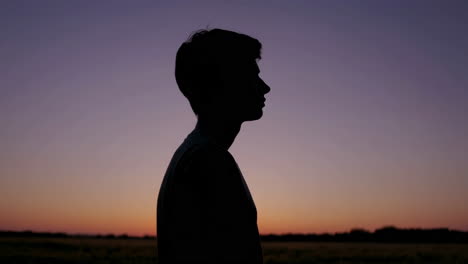 silhouette of a teenager at sunset