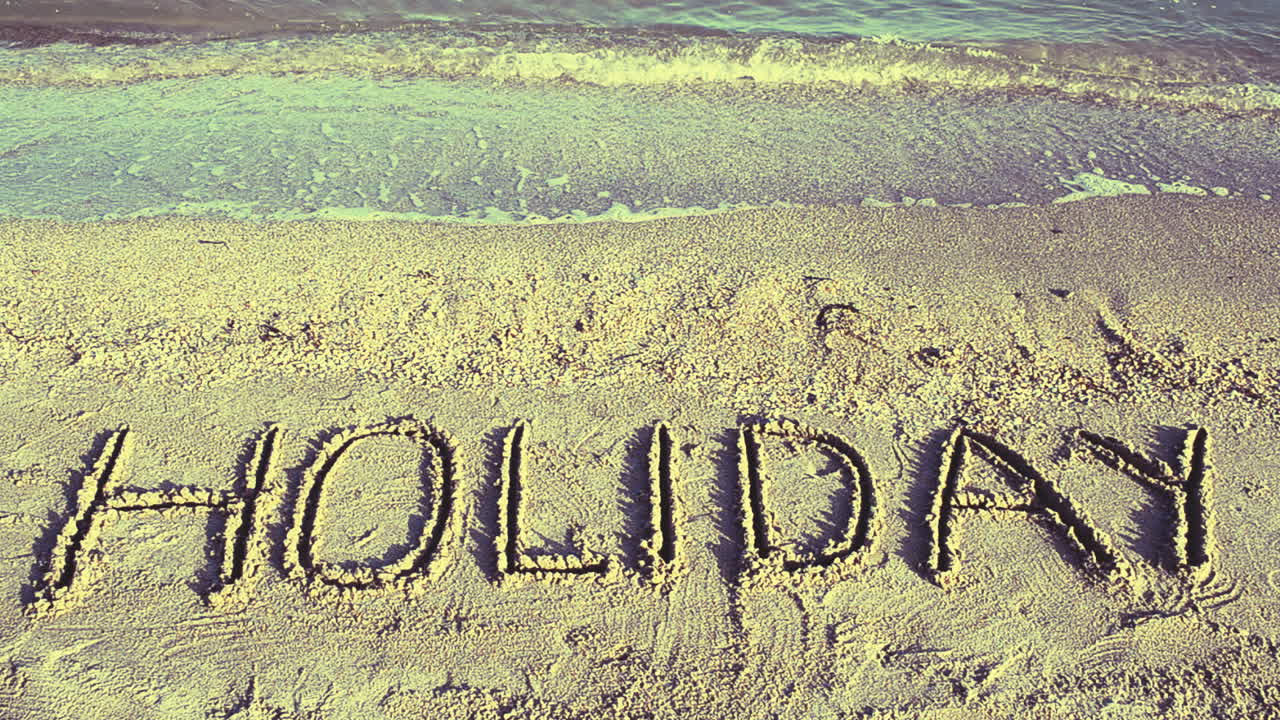 Inschrift im Sand, am Strand. Fotoshooting am Strand