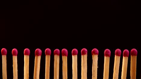 burning matches on a black background.