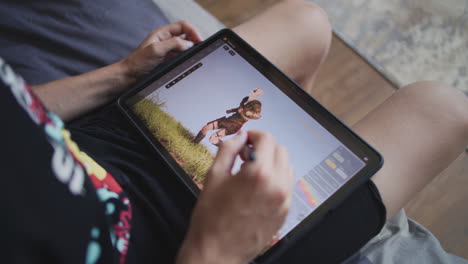 person using tablet for digital art editing