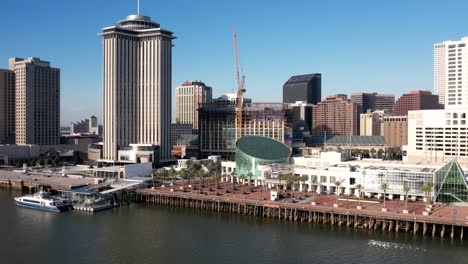 an aerial panoramic view of buildings and landmarks in new orleans along the mississippi river