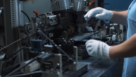 close up engineer processing electrical motor on automatical machine at factory