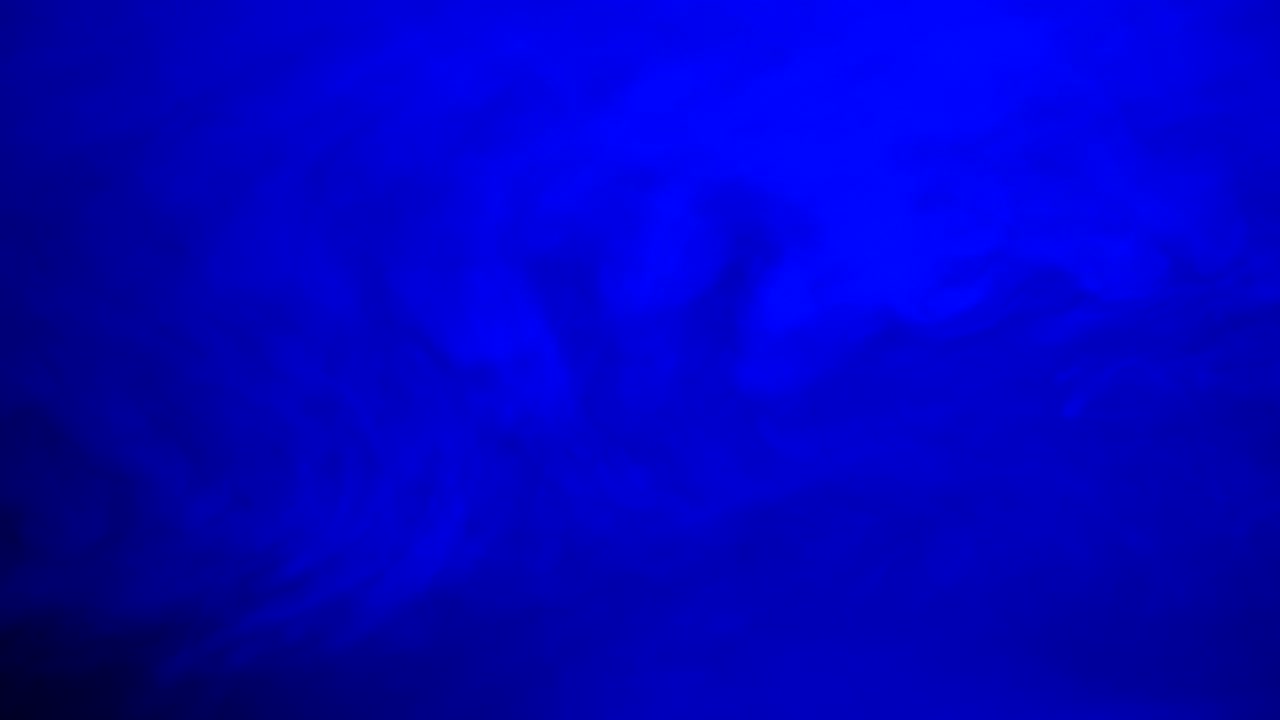 Ambient, abstract, sci fi, ethereal blue smoke and light motion background for mystical, dreamlike, background atmosphere with calm, serene slow motion fog and moving smoke and light.