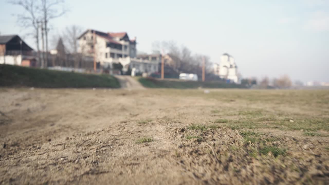 Tire marks in dry ground.