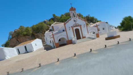 Hermitage-of-Virgen-de-la-Peña-from-an-aerial-view-with-fpv-drone,-Huelva